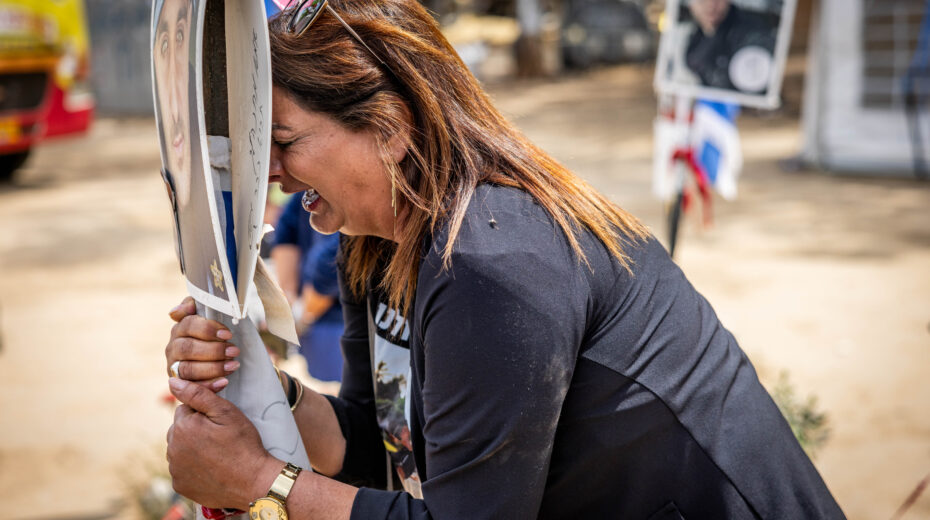Grieving relatives at the site of the Nova Festival. Photo: Chaim Goldberg/Flash90