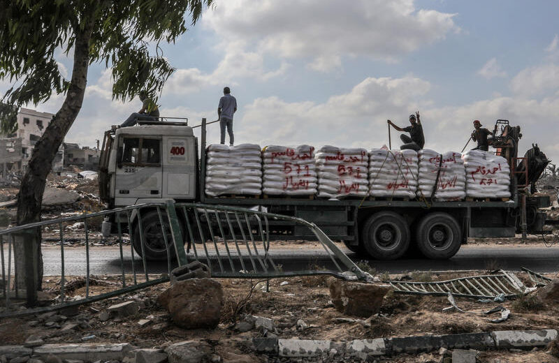 Palestinians seen on trucks loaded with International Humanitarian Aid entering Gaza through the Israeli Kerem Shalom Crossing, in the southern Gaza Strip, July 1, 2024. Photo by Abed Rahim Khatib/Flash90