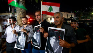 Palestinians hold pictures of Hezbollah Secretary-general Hassan Nasrallah and wave the Lebanese flags during a demonstration against the assassination of Nasrallah by Israel, in the West Bank city of Nablus, September 28, 2024. Photo by Nasser Ishtayeh/Flash90