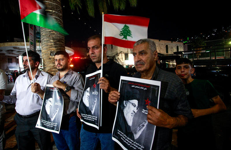 Palestinians hold pictures of Hezbollah Secretary-general Hassan Nasrallah and wave the Lebanese flags during a demonstration against the assassination of Nasrallah by Israel, in the West Bank city of Nablus, September 28, 2024. Photo by Nasser Ishtayeh/Flash90