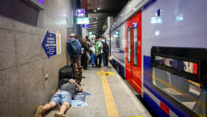Israelis take cover inside a bomb shelter at the Ben Gurion airport as a siren alert is sounded in Tel Aviv, Oct. 1, 2024. Photo by Dor Pazuelo/Flash90.