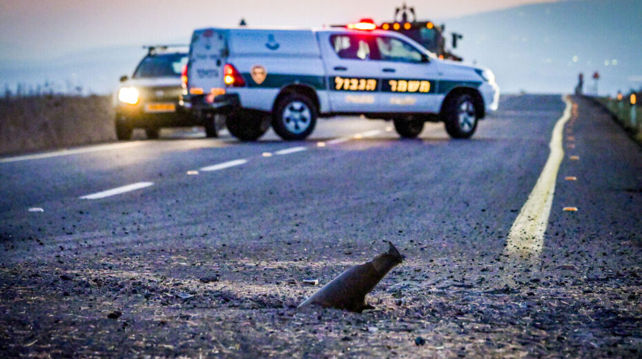 Israeli security forces at the site where a missile fired from Lebanon hit a road near the northern Israeli city of Katzrin, Oct. 4, 2024. Photo by Michael Giladi/Flash90.