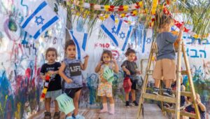 Jewish children learn the customs of Sukkot, the Jewish Feast of Tabernacles, in a kindergarten in Moshav Yashresh on October 10, 2024. Photo: Yossi Aloni/Flash90