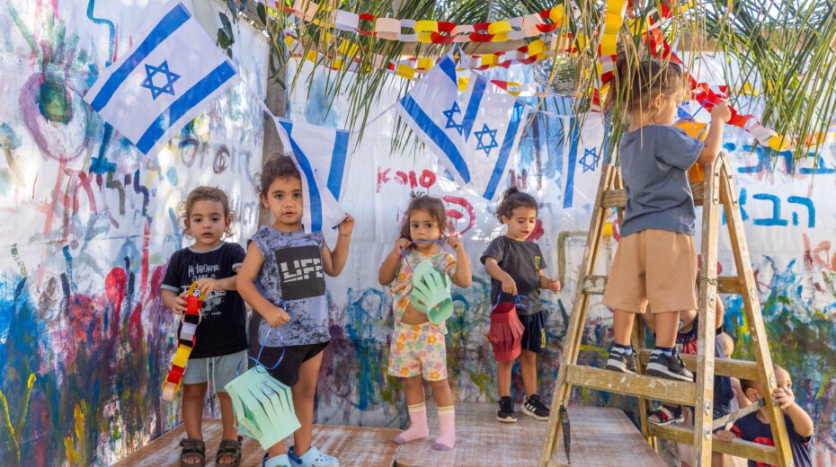 Jewish children learn the customs of Sukkot, the Jewish Feast of Tabernacles, in a kindergarten in Moshav Yashresh on October 10, 2024. Photo: Yossi Aloni/Flash90