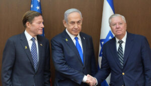 Israeli Prime Minister Benjamin Netanyahu flanked by Democratic Senator Richard Blumenthal (left) and Republican Senator Lindsey Graham, Jerusalem, Oct. 7, 2024. Credit: GPO/Amos Ben Gershom.