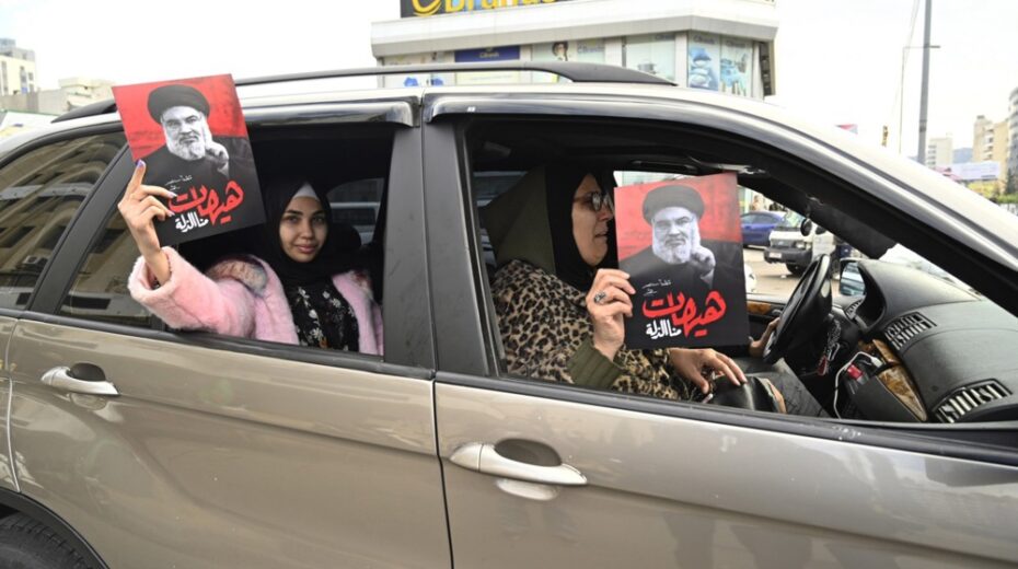 As the Lebanon ceasefire comes into effect, people in Beirut celebrate "victory" by waving Hezbollah flags and holding photos of the terror group's slain leader, Hassan Nasrallah. Photo by EPA-EFE/WAEL HAMZEH