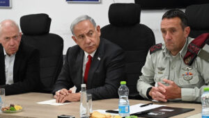 Israel's Prime Minister Benjamin Netanyahu holds a security assessment at Camp Dayan, north of Tel Aviv, after a barrage of rockets were fired from the Gaza Strip. Next to him are Israeli Defense Minister Yoav Gallant (left) and IDF Chief of Staff Herzi Halevy, May 2, 2023. Photo by Haim Zach/GPO.