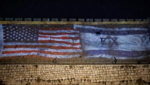 The American and Israeli flags are screened on the walls of Jerusalem's Old City to thank U.S. President Joe Biden for his support for Israel on Oct. 18, 2023. Photo by Yonatan Sindel/Flash90.