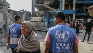 UNRWA officials at the site of an Israeli airstrike in the Nuseirat camp in the central Gaza Strip, July 15, 2024. Photo by Abed Rahim Khatib/Flash90.