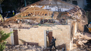 The damage caused to vehicles and buildings from a missile fired from Lebanon last night, in the northern Israeli city of Haifa, Nov. 17, 2024. Photo by Yonatan Sindel/Flash90.