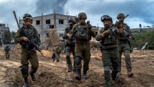 Brig. Gen. Itzik Cohen (center), commander of the IDF's 162nd Division, walks with other officers in Jabalia, the northern Gaza Strip, December 2023. Credit: IDF.