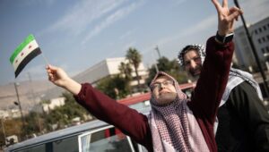 People celebrate in the street after Syrian rebels captured Damascus on 08 December 2024. Photo: EPA-EFE/HASAN BELAL