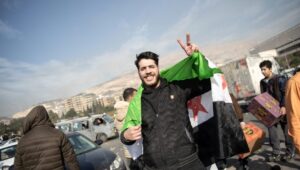 People celebrate in the streets after Syrian rebels captured the city of Damascus, December 8, 2024. Photo: EPA-EFE/HASAN BELAL