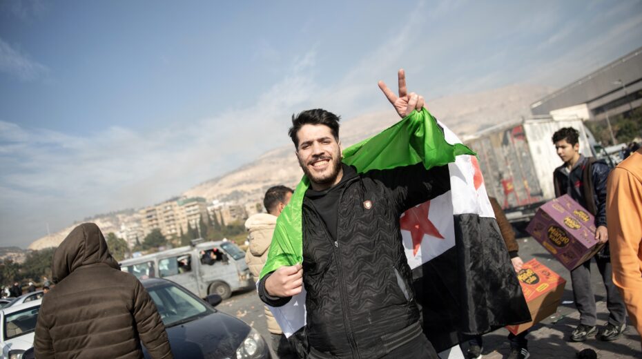 People celebrate in the streets after Syrian rebels captured the city of Damascus, December 8, 2024. Photo: EPA-EFE/HASAN BELAL
