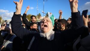 People celebrate the capture of Damascus by opposition forces after Friday prayers at Umayyad Square in Damascus, Syria, December 13, 2024. Photo: EPA-EFE/MOHAMMED AL RIFAI