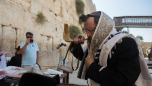 Jewish men pray for the intervention of the Kingdom of Heaven in these harrowing times. Photo by Yonatan Sindel/Flash90
