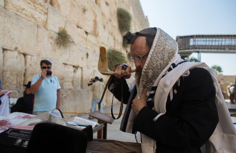 Jewish men pray for the intervention of the Kingdom of Heaven in these harrowing times. Photo by Yonatan Sindel/Flash90
