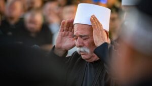 A Druze man mourns the death of IDF Col. Ehsan Daxa in Daliyat al-Karmel, near Haifa, on Oct. 21, 2024. Photo by Michael Giladi/Flash90.