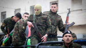Palestinian security forces and mourners attend the funeral of Ibrahim Jumaa, a member of the Palestinian Preventive Security Services, in the West Bank city of Nablus on December 27, 2024. He was killed in clashes with Palestinian militants in the Jenin refugee camp. Photo by Nasser Ishtayeh/Flash90