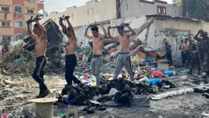 Terrorists surrender to Israeli forces near Kamal Adwan Hospital in northern Gaza, Dec. 14, 2023. Credit: IDF.