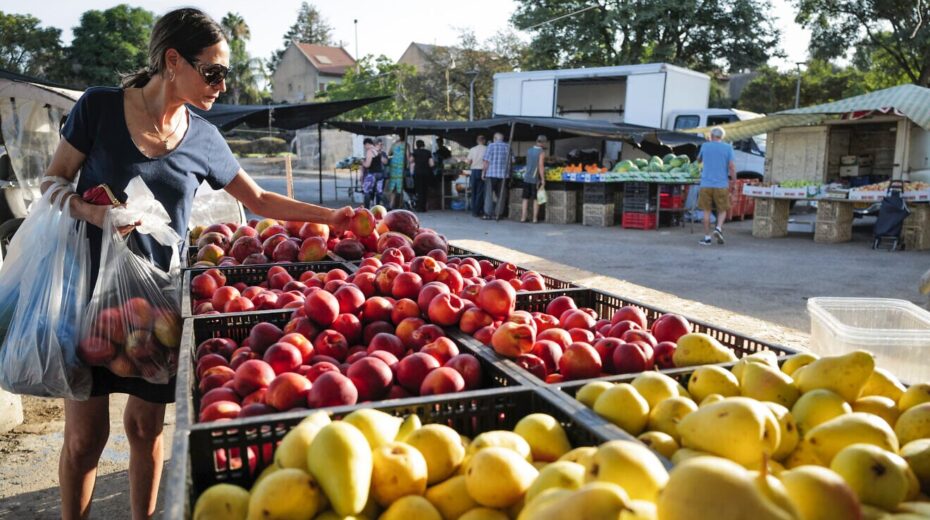 A woman shops at Katzrin's Tuesday Market on the Golan Heights, Aug. 27, 2024. Photo by Michael Giladi/ Flash90.