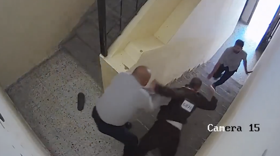 Screenshot of security camera footage showing Hamas officers abusing local prisoners in the Gaza Strip.