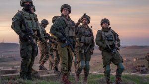 IDF officers survey the Syrian side of Mount Hermon. Credit: IDF Spokesman