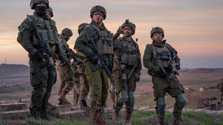 IDF officers survey the Syrian side of Mount Hermon. Credit: IDF Spokesman