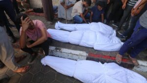 Bodies lie at the entrance to Al-Aqsa Martyrs Hospital in Deir al-Balah, in the central Gaza Strip, on Sept. 7, 2024. Photo by Ali Hassan/Flash90