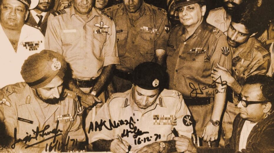 Lieutenant General JFR Jacob (second row, 4th from left) signing the surrender of the West Pakistani units in 1971. Photo: Indian Navy, GODL-India, via Wikimedia Commons