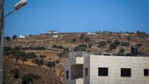 The Jewish community of Oz Zion is seen from Burqa during the funeral of Palestinian Kosai Ma'atan, Aug. 5, 2023. Credit: Flash90.