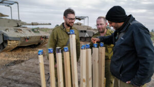 Israeli reservists light a Hanukkah menorah on the Syrian border. Photo by Michael Giladi/Flash90