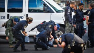 Security personnel at the scene of a drone attack in Tel Aviv, July 19, 2024. Photo by Avshalom Sassoni/Flash90.