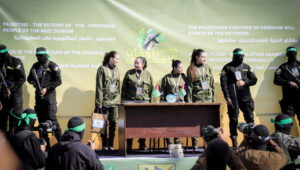 Al-Qassam Brigades, the military wing of Hamas, hand over four Israeli hostages to the Red Cross in Palestine Square, in Gaza City. Photo by Khalil Kahlout/Flash90