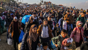 Palestinians return to their homes in the northern Gaza Strip via the Rashid Street by the Mediterranean Sea as part of the ceasefire agreement in central Gaza, Jan. 27, 2025. Photo by Abed Rahim Khatib/Flash90.