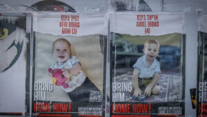 Posters of the Bibas boys, Kfir and Ariel, hang on a wall outside the Knesset in Jerusalem, Feb. 19, 2024. Photo by Chaim Goldberg/Flash90.