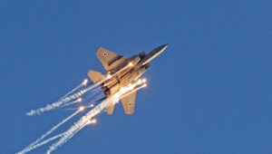 An F-15 Baz during an airshow with flares performs at the Hatzerim Air Force Base, June 24, 2021. Credit: Ofer Zidon/Flash90.