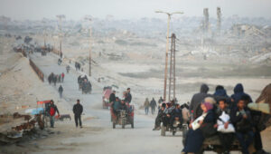 Palestinians travelling from south to north through the Gaza Valley on al-Rashid Street in the Nuseirat region on February 13, 2025. Photo by Ali Hassan/Flash90