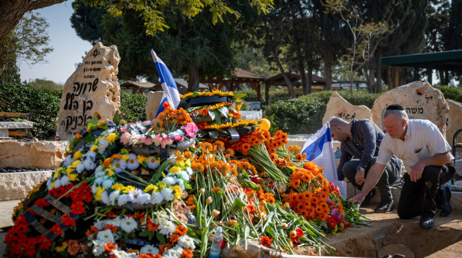 Mourners near the fresh grave of late Israeli hostages Shiri Bibas and her children Ariel and Kfir at the cemetery in Tzohar, southern Israel, Feb. 26, 2025. Photo by Chaim Goldberg/Flash90.