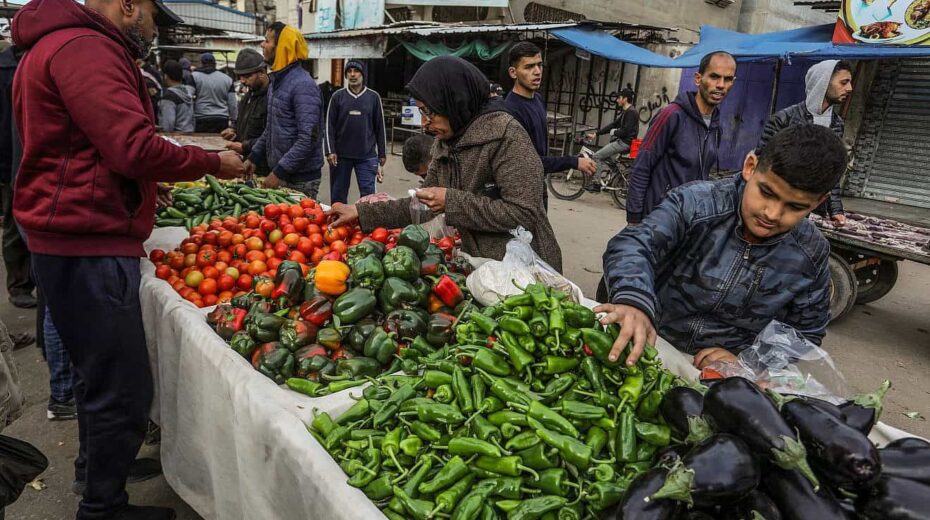 Palestinians shop for fruit and vegetables at a market in Rafah, in the southern Gaza Strip, on Jan. 13, 2024. Photo by Abed Rahim Khatib/Flash90.
