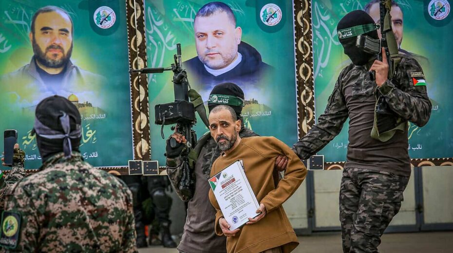 Hamas's Al-Qassam Brigades parade Israeli captive Eli Sharabi in Deir al-Balah, the Gaza Strip, before handing him over to the International Red Cross, Feb 8, 2025. Photo by Abed Rahim Khatib/Flash90.