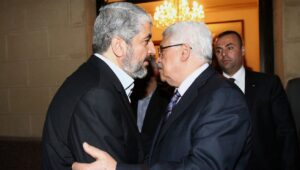 Hamas leader Khaleed Meshaal (left) meets with Palestinian Authority leader Mahmoud Abbas in Cairo, to implement the terms of a reconciliation deal they signed in the Egyptian capital in May 2011, which called for an interim government and general elections in a year, on Feb. 23, 2012. Photo by Mohammed al-Hums/Flash90.