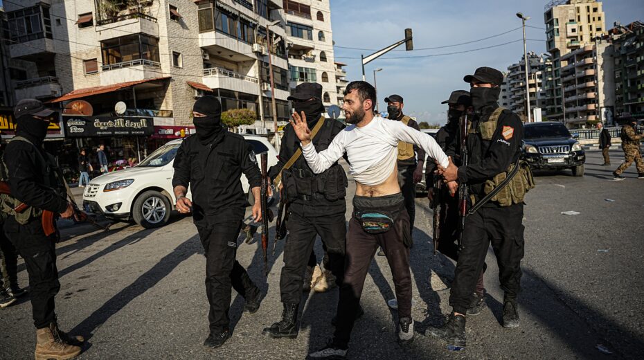 Syrian security forces arrest a man suspected of being a former Syrian regime supporter, following clashes between government forces and supporters of the former Syrian regime in Latakia, Syria, March 8, 2025. Photo: EPA-EFE/MOHAMAD DABOUL