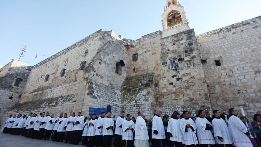 Clergymen gather in the Manger Square outside the Church of Nativity in the city of Bethlehem on Dec. 24, 2012. Photo by Issam Rimawi / Flash90.