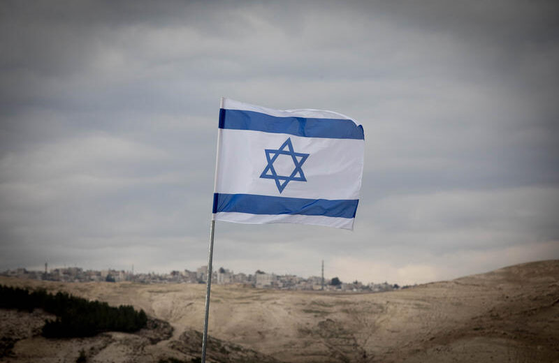An Israeli flag planted on a hilltop in the biblical heartland, just east of Jerusalem. Photo by Yonatan Sindel/Flash90