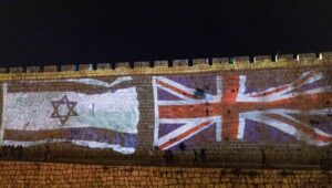 The Union Jack and Israeli flags are screened on the walls of Jerusalem's Old City following the death of Britain's Queen Elizabeth, September 8, 2022. Photo by Yonatan Sindel/Flash90