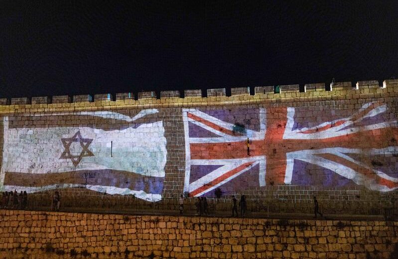The Union Jack and Israeli flags are screened on the walls of Jerusalem's Old City following the death of Britain's Queen Elizabeth, September 8, 2022. Photo by Yonatan Sindel/Flash90