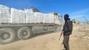 Palestinian trucks loaded with aid flow into Gaza through the Kerem Shalom crossing as part of the ceasefire agreement in the Gaza Strip, east of the city of Rafah in the southern Gaza Strip. Photo by Abed Rahim Khatib.