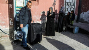 Palestinians at the Rafah Crossing waiting to leave the Gaza Strip. Photo by Abed Rahim Khatib/ Flash90