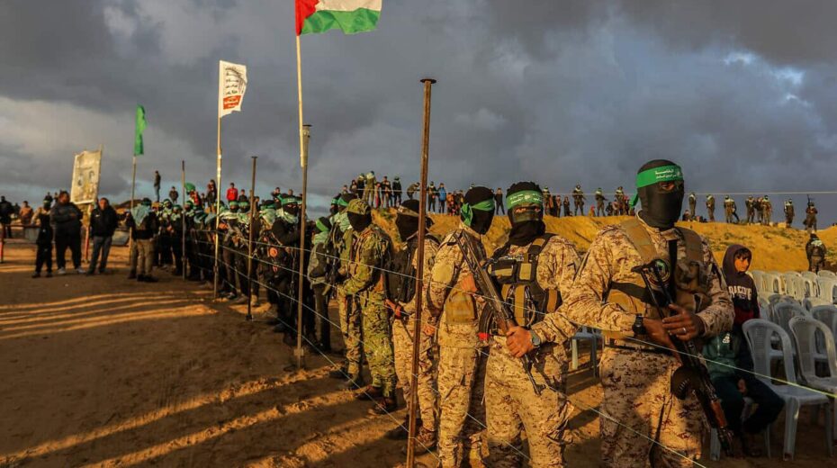 Al-Qassam Brigades terrorists and ordinary Gazans waiting for the handover of the bodies of four Israeli hostages to the Red Cross in Khan Yunis, Feb. 20, 2025. Photo by Abed Rahim Khatib/Flash90.
